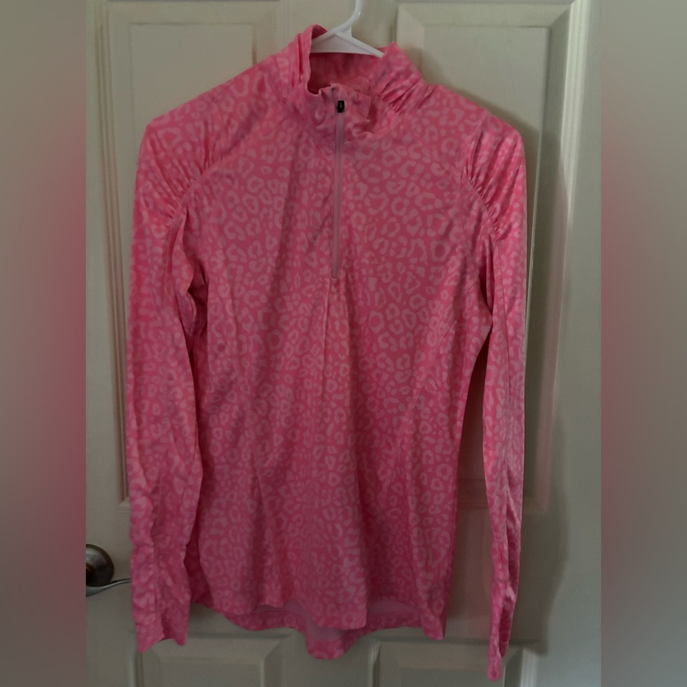 Pink and white cheetah print long sleeve. A tighter fit, quarter zip.